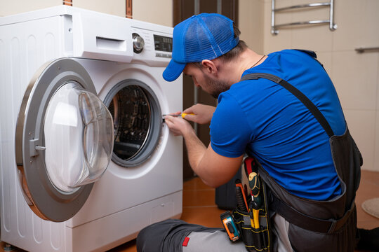 Technician repairing an appliance